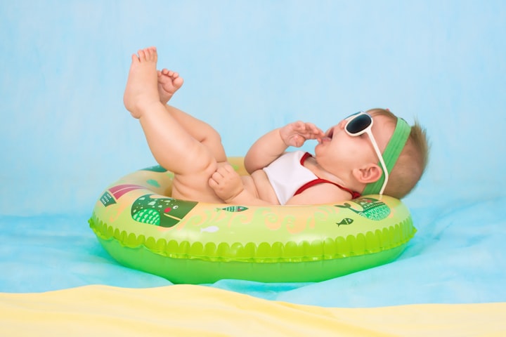 Family photographer's portrait of a parent and newborn